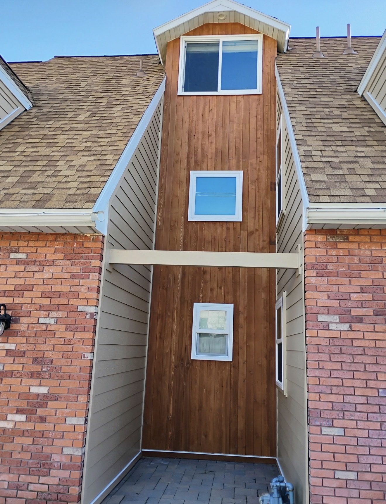 Middle nook after, stained Douglas fir accent between two brick wings