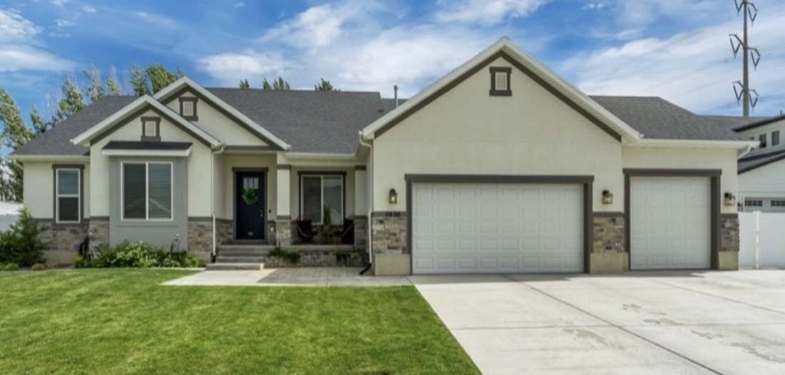 Home before, tan stucco exterior