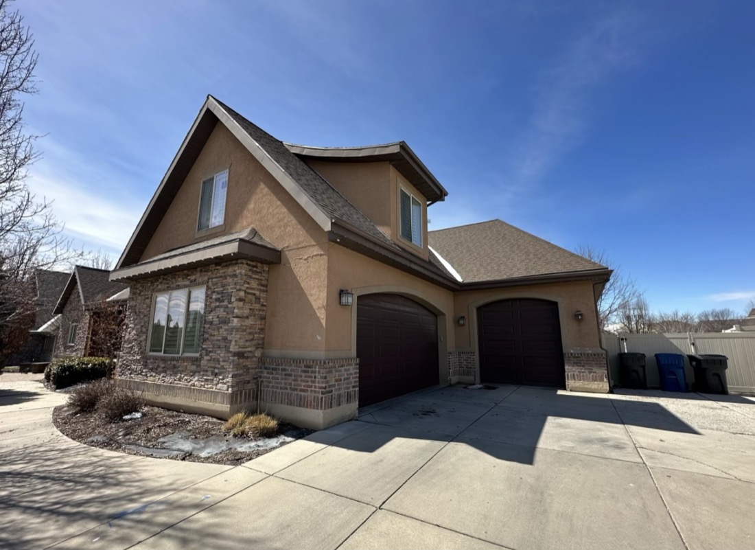Home before, tan and orange stucco exterior